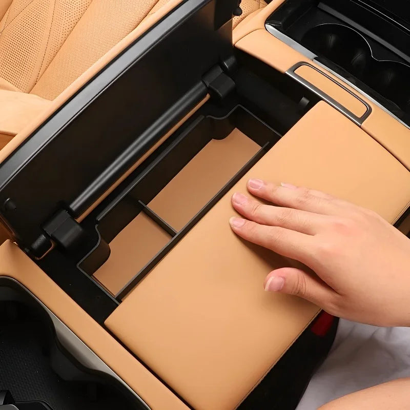 Tan leather center console organizer with compartments for BYD interior.