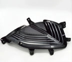 Glossy black ABS plastic car grille insert with a textured slatted design