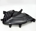 Glossy black automotive front grille insert with a sleek, ribbed design.