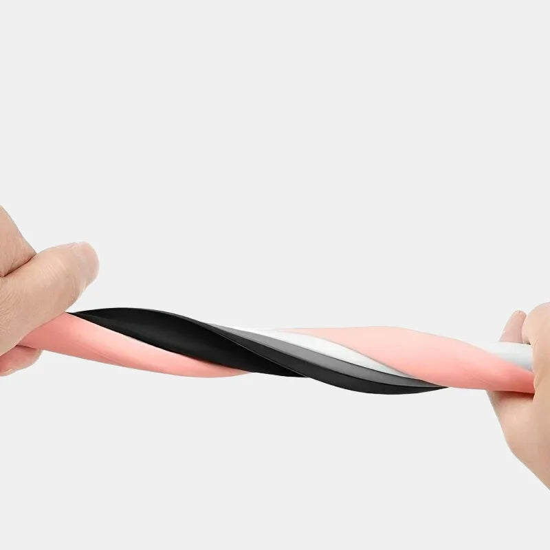 Hands twisting a flexible, multi-layered pink, black, and white protective material.