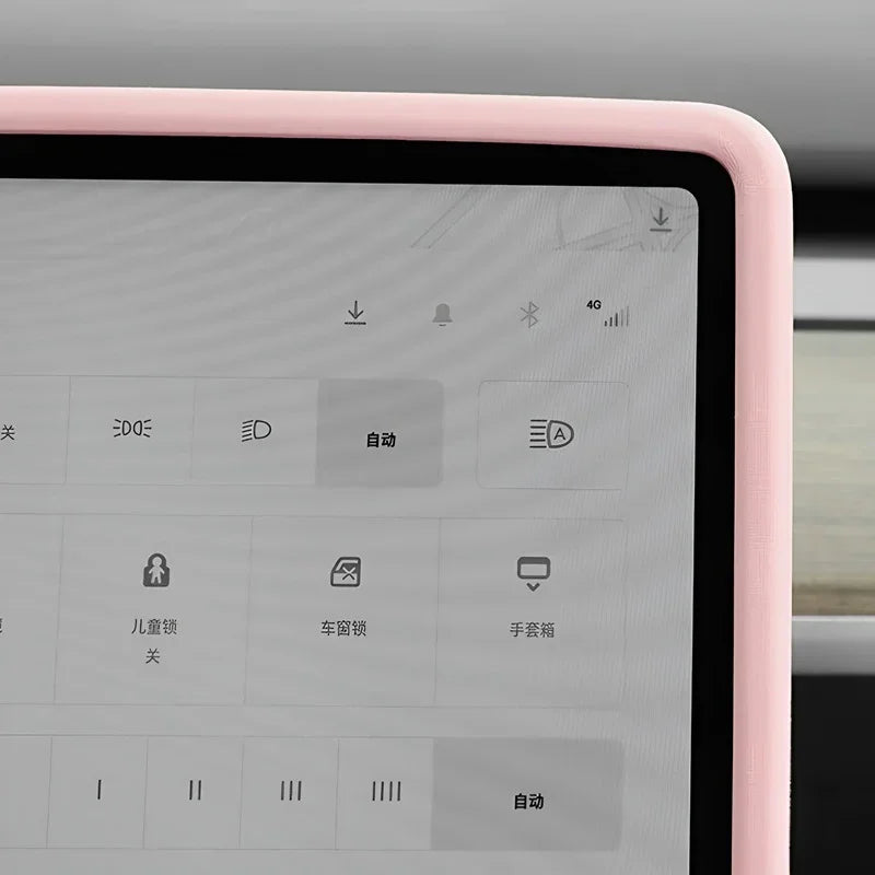 Close-up of a pink textured protective bezel frame for a car infotainment screen.