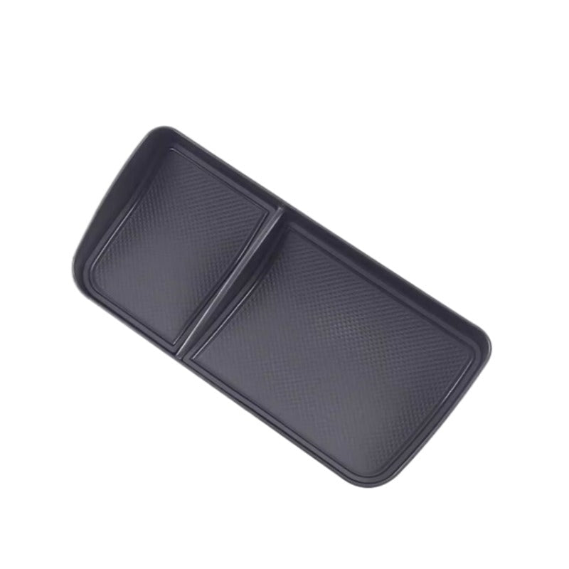 Professional black textured plastic center console organizer tray for car interiors.