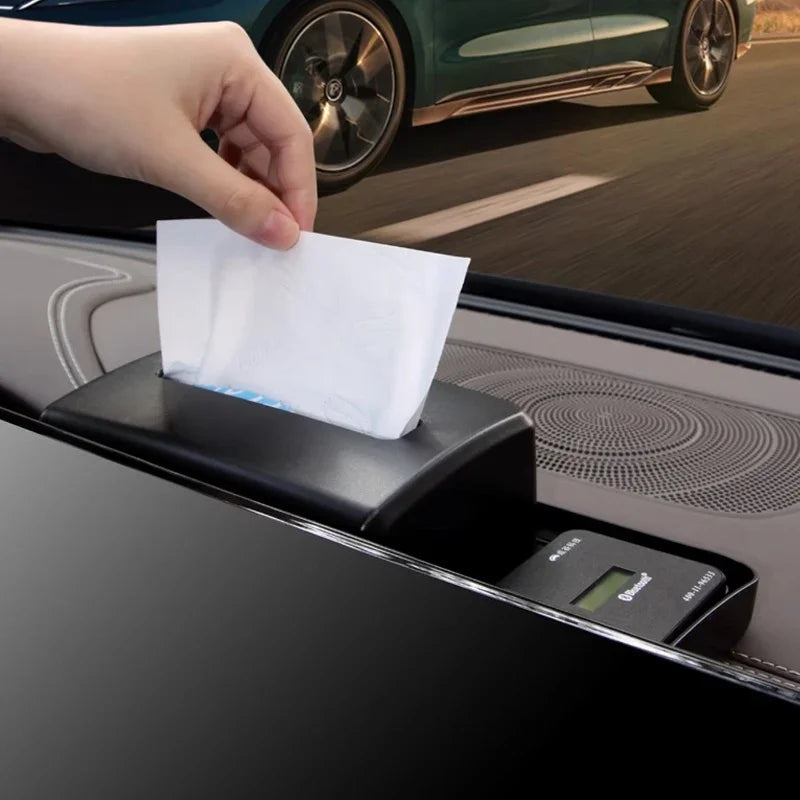 Black premium leather car tissue box holder installed on a vehicle dashboard.