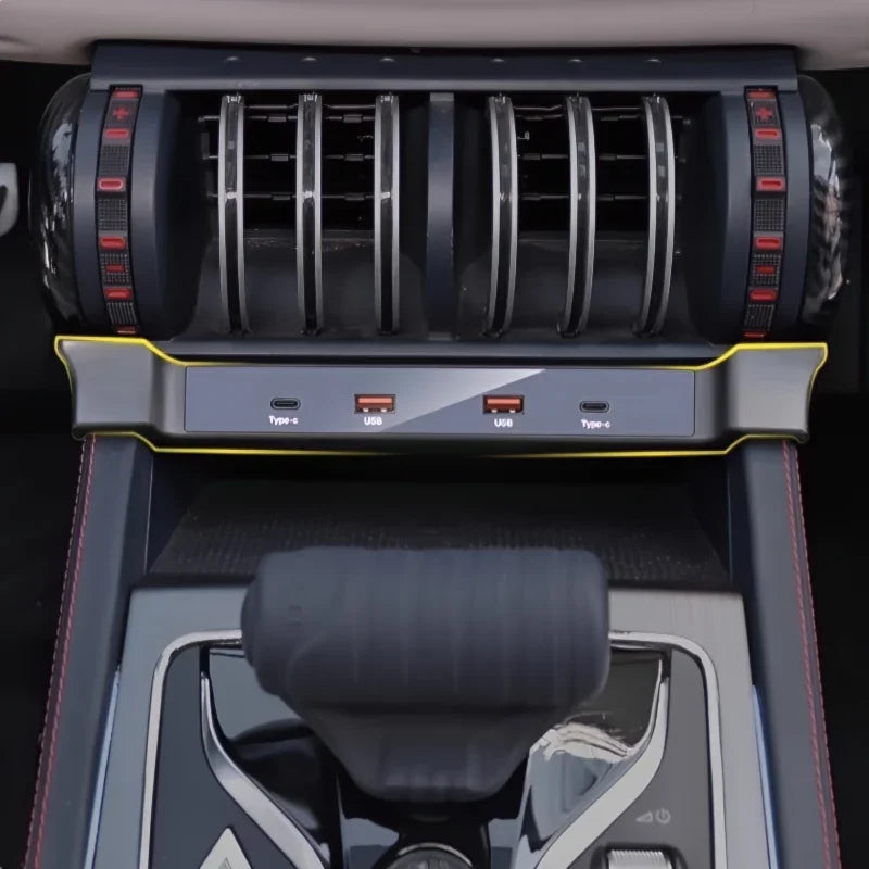 Interior view of a car dashboard featuring black air vents and multiple USB and Type-C charging ports.