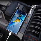Smartphone charging via USB cable in a car console next to a black gear shifter.