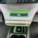 Mint green BYD Dolphin center console organizer tray with black carbon fiber texture dolphin logo.