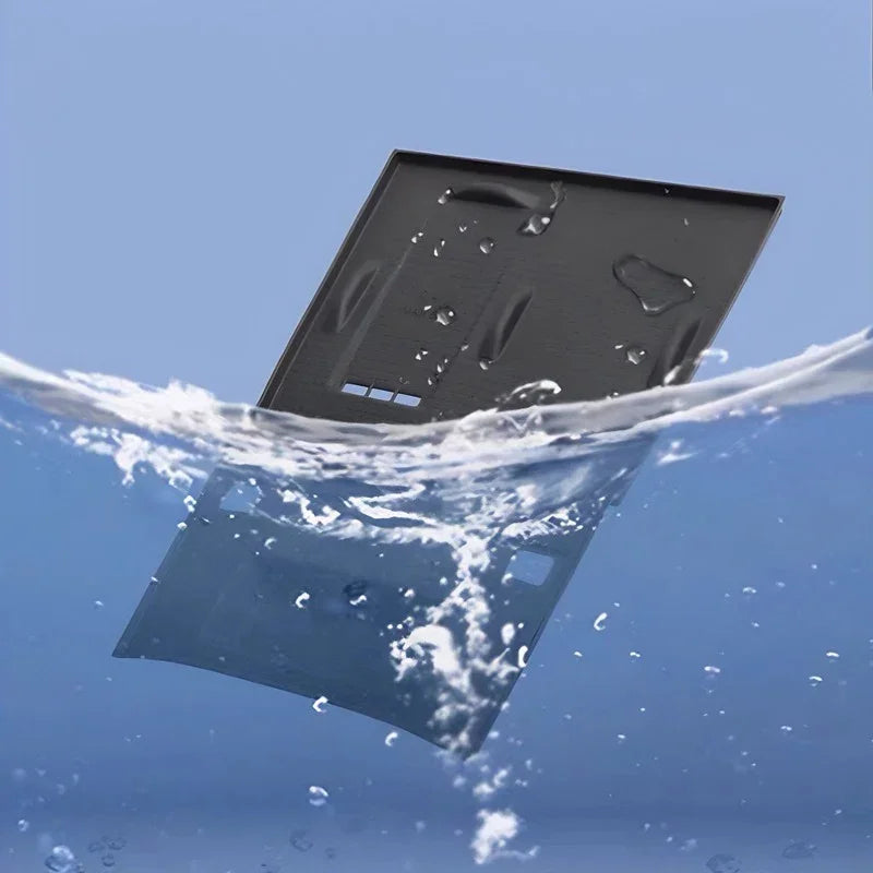 Waterproof black matte car trunk mat partially submerged in clear water.