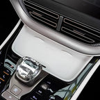 White premium leather center console cover with a sleek silver metallic gear selector.
