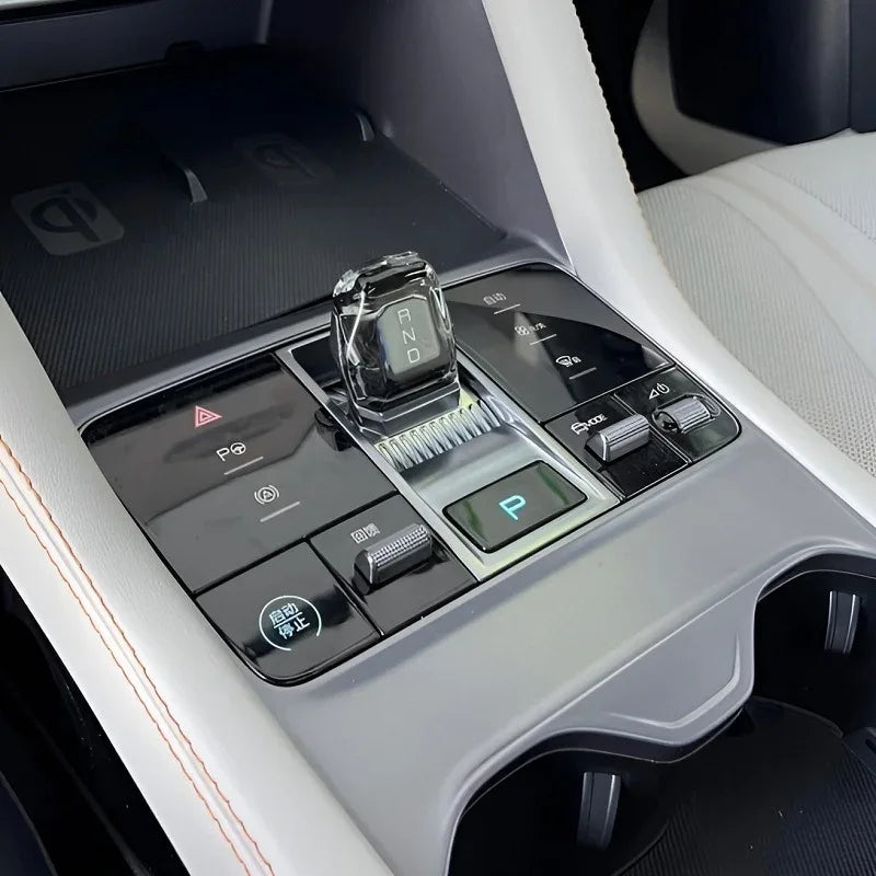 Crystal gear shifter with RND markings on a sleek black gloss center console.