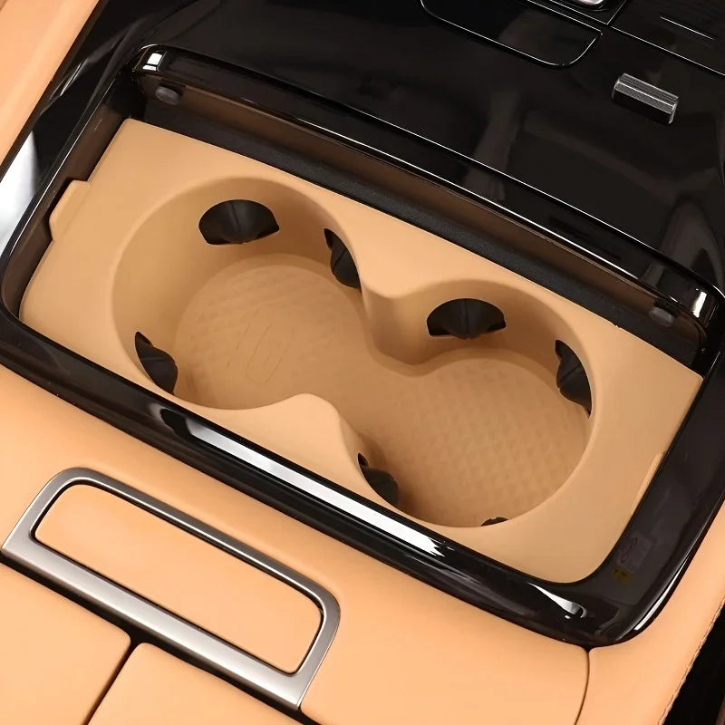 Tan leather-textured cup holder insert for BYD vehicle interior, providing durable protection.