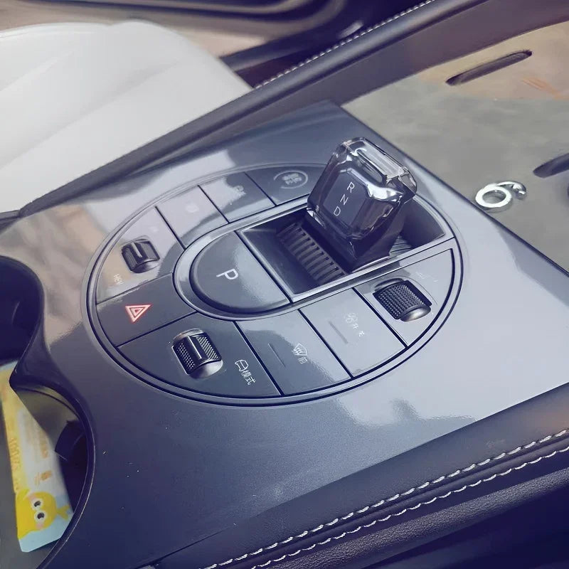 Black crystal gear shifter with RND markings on a BYD center console.