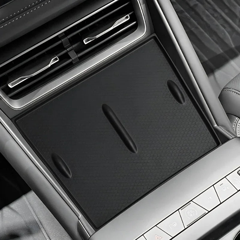 Black textured non-slip silicone center console mat for BYD vehicle interior protection.