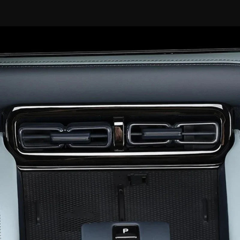 Black glossy chrome air vent trim with sleek metallic finish for car interior enhancement.
