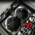 Glossy black BYD center console cup holder inserts with textured anti-slip pads.