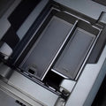 Black textured carbon fiber style organizer tray for BYD center console storage.