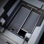 Black textured carbon fiber style organizer tray for BYD center console storage.