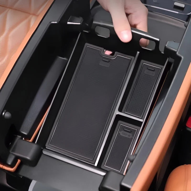 Black textured non-slip organizer tray for car center console storage.