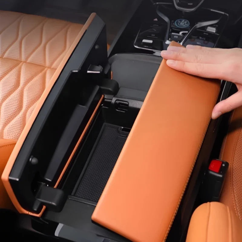 Tan leather center console armrest cover with premium stitching for BYD interior protection.