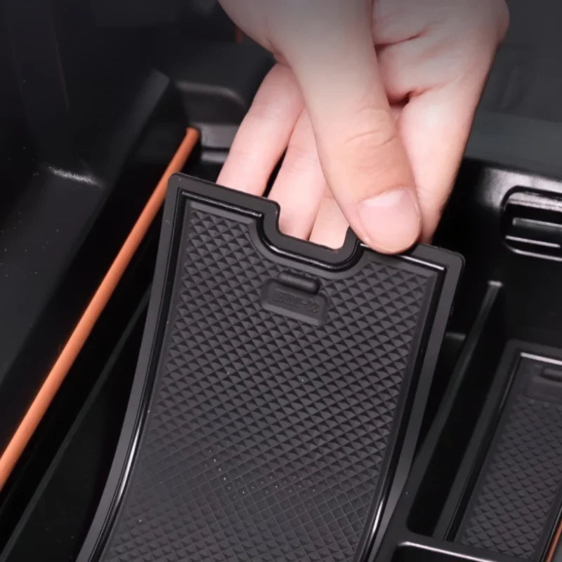 Black textured anti-slip silicone tray liner for BYD car center console storage.