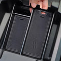 Black textured silicone center console tray organizer for BYD vehicle interior.