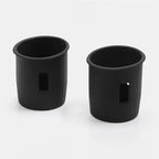 Pair of matte black durable plastic car cup holders with vertical ribbed texture.
