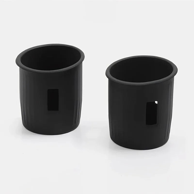 Pair of matte black durable plastic car cup holders with vertical ribbed texture.