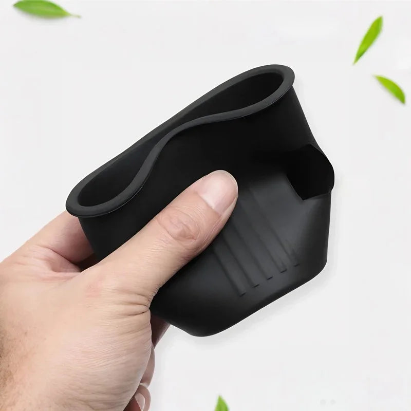 Black matte silicone car cup holder extender with non-slip textured grip.