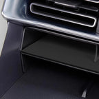 Black carbon fiber texture center console storage tray for BYD vehicle interior.