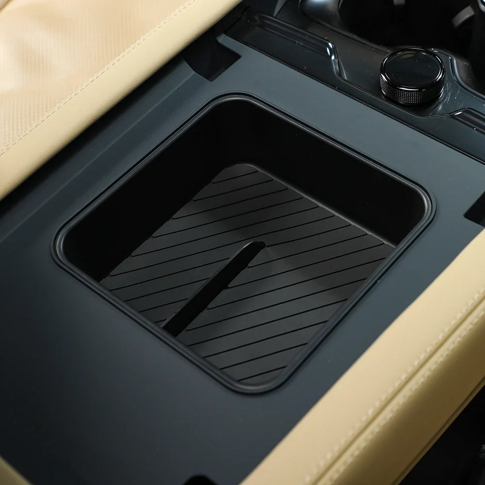 Black matte rubber center console storage tray with anti-slip ridges for BYD interior