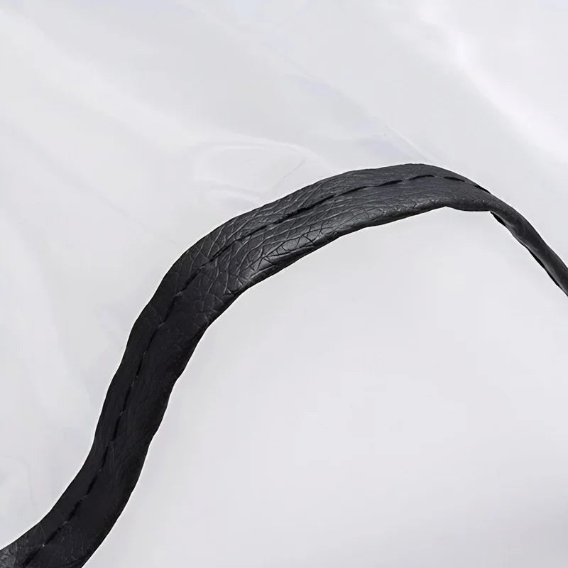 Black textured faux leather trim on a clear waterproof protective material.