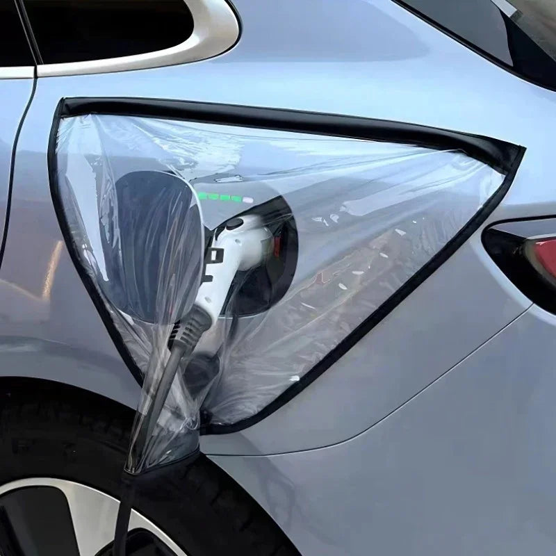 Transparent waterproof PVC protective cover for electric vehicle charging port on silver car.