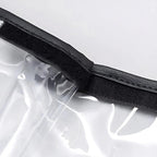 Close-up of clear waterproof PVC material with a durable black textured edge trim.