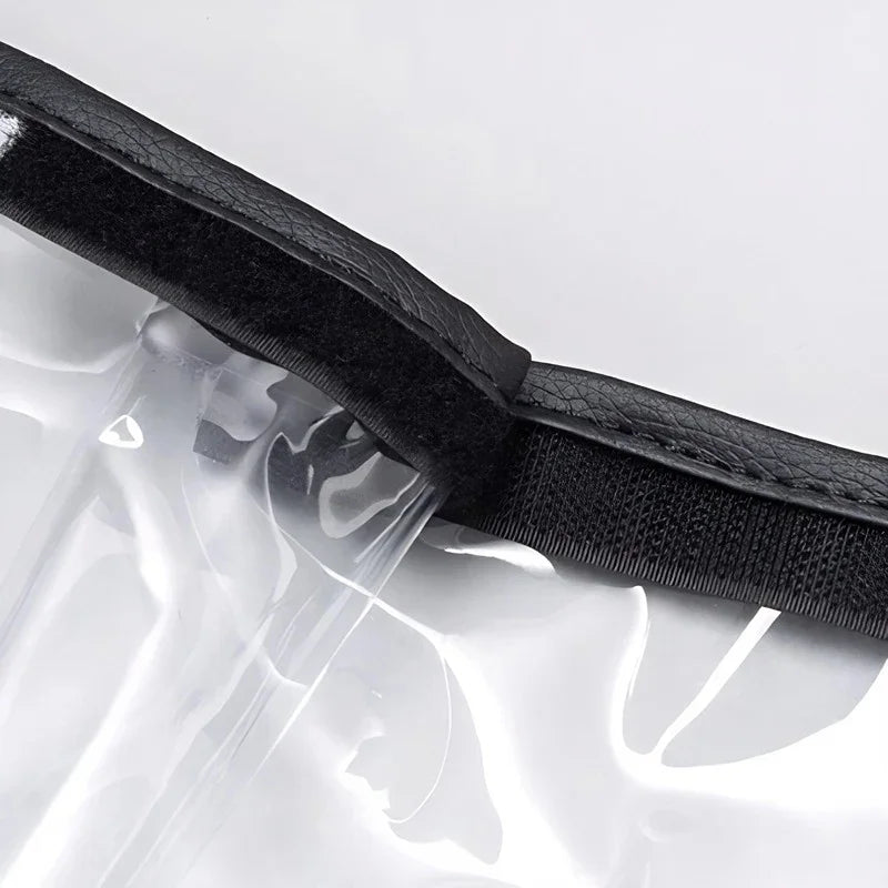 Close-up of clear waterproof PVC material with a durable black textured edge trim.