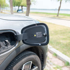 A black protective cover for a BYD electric vehicle charging port, featuring a durable design.
