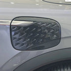 Black carbon fiber texture fender vent cover for car side panel protection.