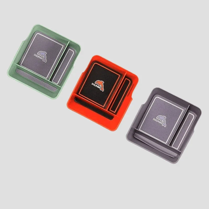 Set of three Dolphin brand rectangular car cup holder mats in green, red, and grey silicone.