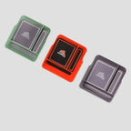 Set of three Dolphin brand rectangular car cup holder mats in green, red, and grey silicone.