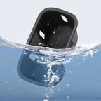 Waterproof black matte car cup holder accessory partially submerged in clear splashing water.