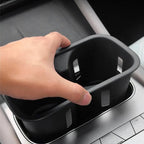 Black matte plastic car center console organizer tray for efficient storage.