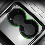 Black dual car cup holder organizer with vibrant green trim and textured non-slip surface.