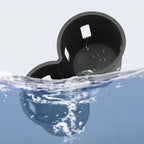 Black waterproof car cup holder accessory floating in clear blue water.