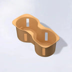 Tan dual-compartment silicone cup holder organizer for BYD vehicle interior.