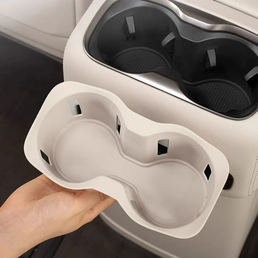 Cream white dual-compartment car cup holder tray made of durable matte material.
