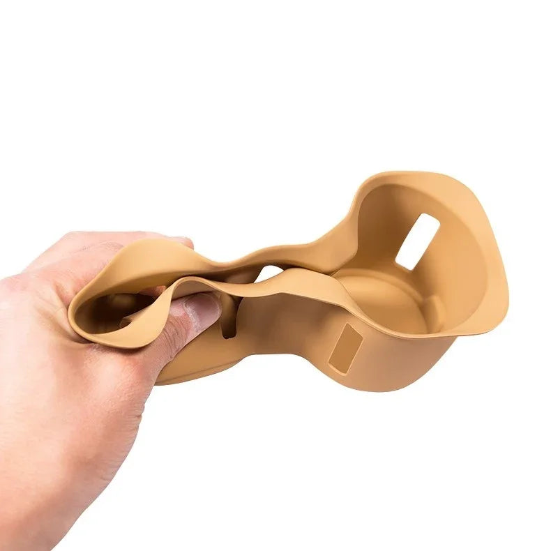Flexible tan silicone car cup holder accessory showing durable, bendable material.