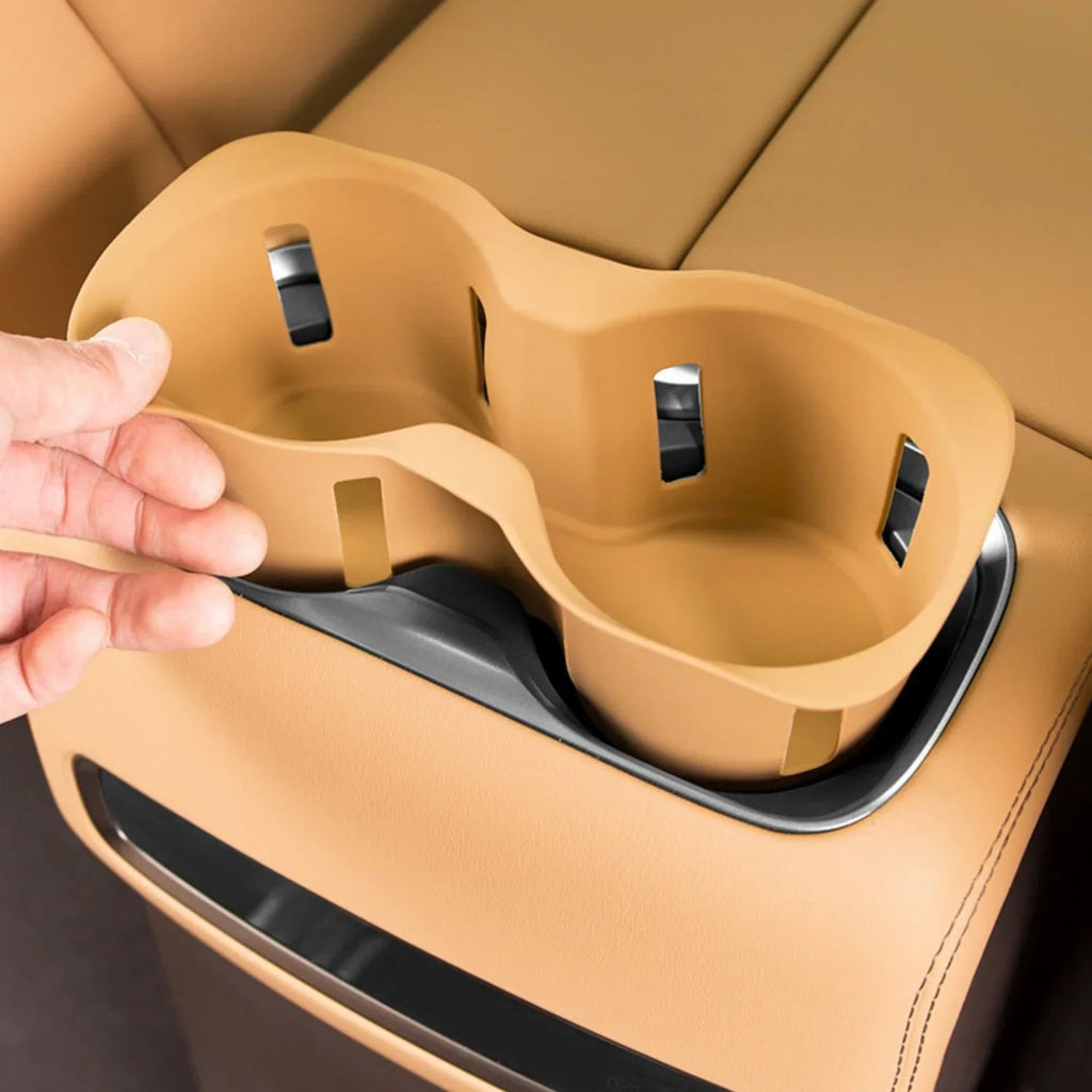 Tan leather-style dual car cup holder insert for seamless interior integration.