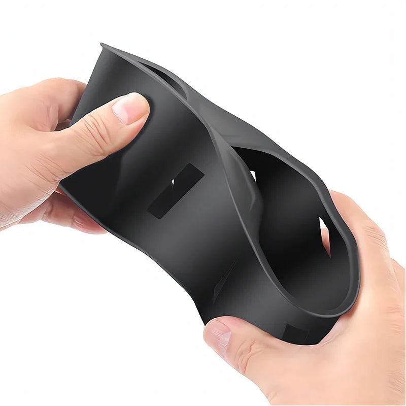 Flexible black matte silicone car cup holder organizer being demonstrated for durability.