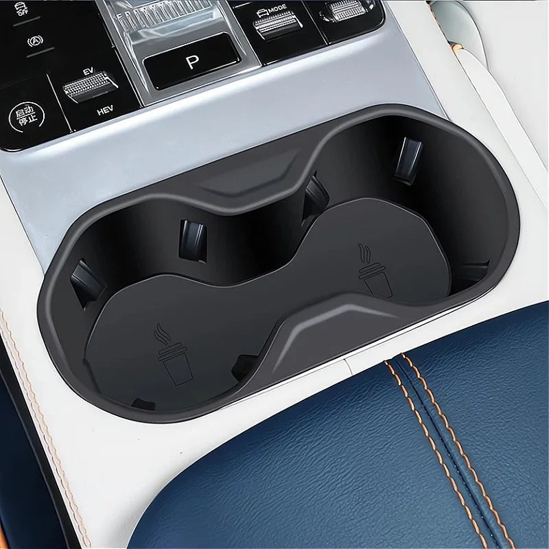Black matte durable plastic dual cup holder insert for car center console.