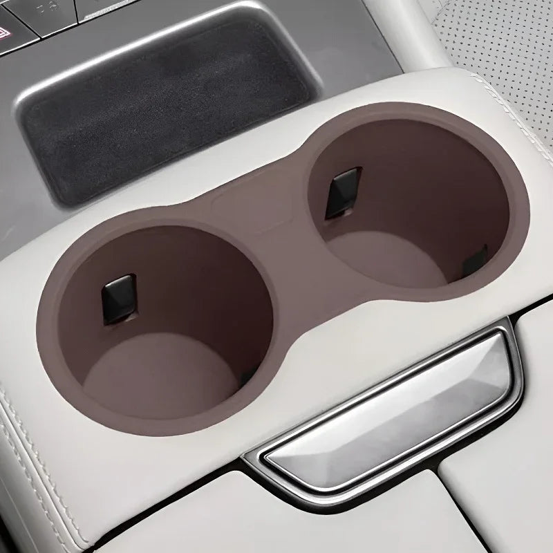 Durable brown silicone cup holder liners for BYD car center console protection.