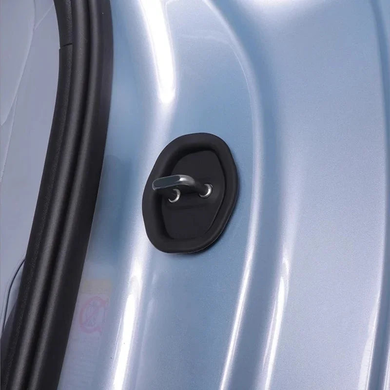 Black matte rubber door lock cover protecting the silver car door lock mechanism.