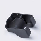Matte black textured plastic interior storage organizer tray for car console.
